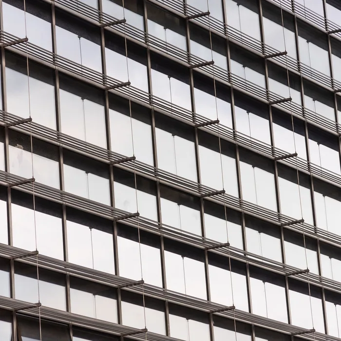 Commercial glass facade with tinted windows for glare and heat control